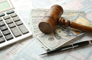 Judge's,Gavel,And,Dollar,Banknotes,On,Income,Tax,Form,Background